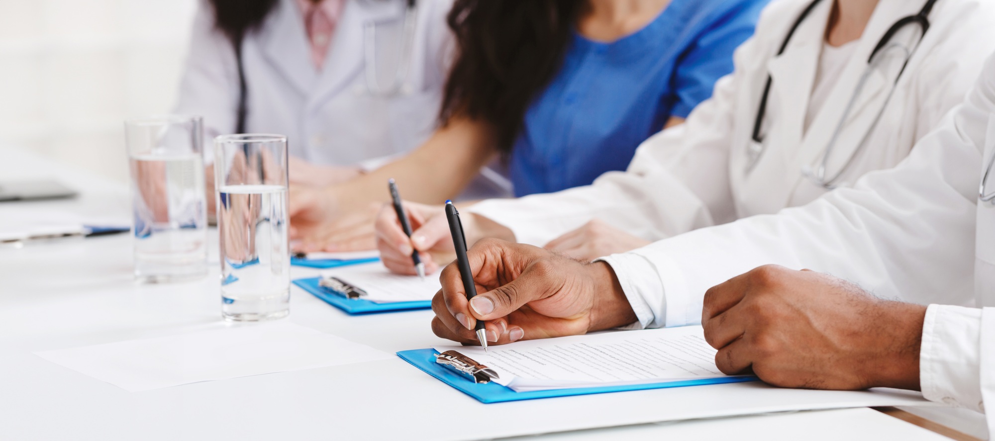 Medical Education. Doctors Writing Notes At Conference